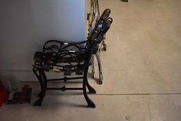 A pair of cast metal bench ends