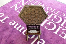 A Persian style folding table/lamp stand of small proportions, having hexagonal top with inlaid