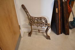 A pair of cast metal bench ends