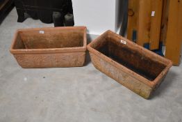 A pair of terracotta planters, each approx. 42 x 20cm