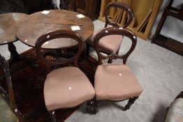 A group of three Victorian mahogany balloon back dining chairs, of traditional design with pink fish