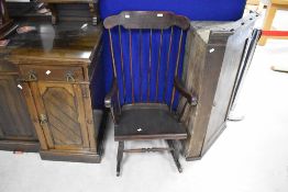 A 20th century spindle back rocking chair, of traditional design, seat height 38cm