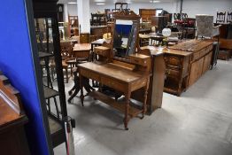 A Victorian ash dressing table having two drawers with brass drop handles, on turned frame, width