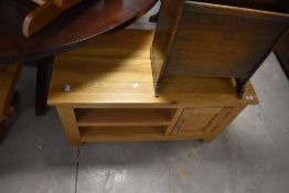 A modern golden oak TV cabinet, approx. Width 90cm