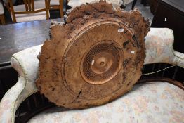 A sectional piece of burr elm, with turned centre, width approx. 80cm