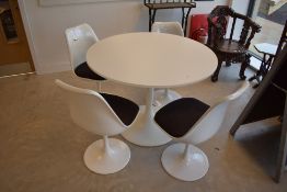An Ikea 'Docksta' tulip table and set of four similar chairs, in the Arkana style, diameter approx
