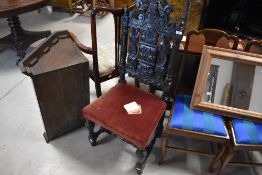 A 19th century carved oak dining chair in the Charles II style with arched, pierced and carve