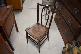 A traditional bentwood chair having ply seat