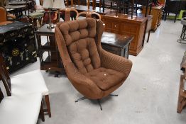 A vintage VONO Penthouse egg chair in brown corduroy