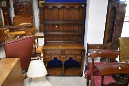 A nice quality reproduction oak dresser of small proportions, most probably Titchmarsh and