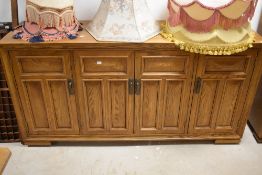 A modern oak sideboard, dimensions approx. W163 H82 D46cm