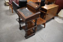 A Victorian walnut Davenport style desk have compartmental upper section, lift flap on turned frame,