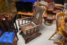 A Victorian American style rocker having typical turned frame