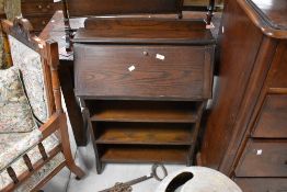 An early 20th Century oak bureau bookshelf of small proportions, width approx. 66cm