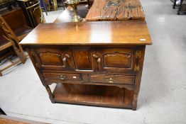A nice quality reproduction oak sideboard or dresser base of small proportions, most probably