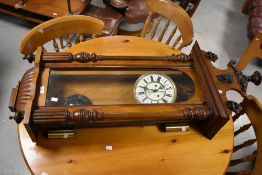 A 19th Century mahogany cased Vienna style wall clock having enamelled dial with red fleur de lys
