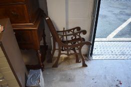 A pair of cast metal bench ends