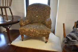 A Victorian buttoned back easy chair, with tub-from back and turned front legs and casters, seat