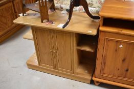 A modern oak side cabinet having central cupboard flanked , dimensions approx. W91 H73 D45cm