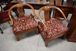A pair of Oriental hardwood carver chair in the Chinese style