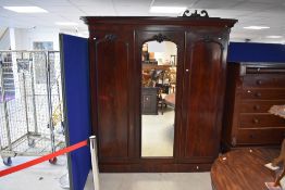 A Victorian mahogany triple wardrobe/linen press , having central mirror door, dimensions approx.