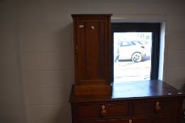 A Victorian mahogany pot cupboard in need of some restoration