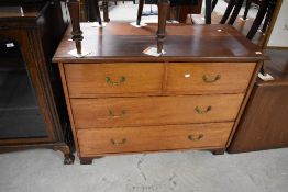 An early 20th Century mahogany chest of two over two drawers having brass drop handles, on bracket
