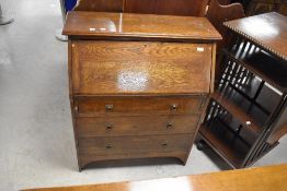 An early 20th Century oak bureau of shallow proportions, dimensions approx. W84 H102 D39cm