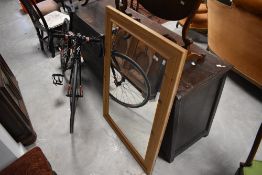 A large rectangular pine framed wall mirror 77cm x 109cm