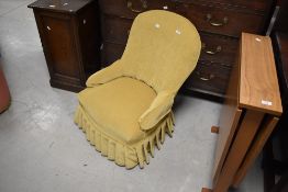 A vintage mustard dralon nursing chair