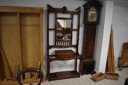 A Victorian mahogany hall stand, having large central mirror with spindle supports, drawer section