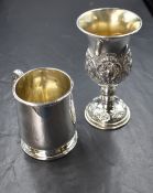 A George V silver tankard, of traditional form having a moulded rim and c-curve handle, raised on