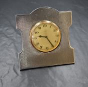 A George V silver mounted desk clock, having engine turned decoration, marks for Birmingham 1924,