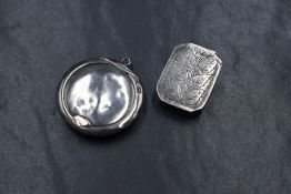A George III silver vinaigrette, of hinged rectangular form having canted corners and foliate