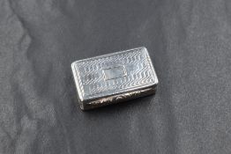 A George IV silver vinaigrette, of hinged rectangular form having engine turned decoration with a