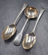 A George III silver Old English pattern serving spoon, having a heraldic crest to terminal, marks