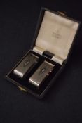 A cased pair of Elizabeth II silver napkin rings, of oval form having engine turned decoration