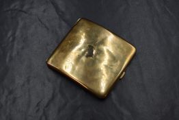 A 9ct gold cigarette case, of hinged rectangular form curved for the pocket, rubbed marks for