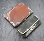 An Edwardian silver mounted leather purse, the rectangular green leather purse having a silver