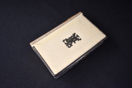 A George V silver mounted appointment book, the book covered in imitation ivory having a central
