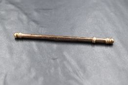 A 20th century 9ct gold cocktail swizzle stick, engraved 'LT. Col. G.A.T. PRITCHARD R.E H.Q 464