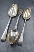 A group of three Georgian silver serving spoons, two of Old English pattern and one of fiddle