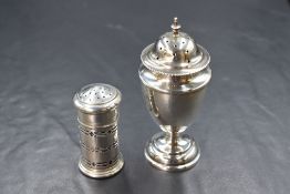 An Edwardian silver pepperette, of fluted form having bead thread rim raised on a circular step