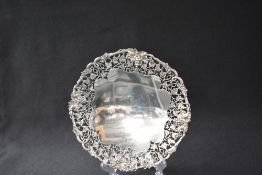 A George VI silver pedestal dish, having a decorative grapevine motif and pierced foliate rim,