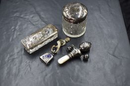 A George V silver and mother-of-pearl baby's rattle, of doll form having bells to either side on a