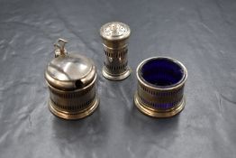 A George V silver three piece cruet set, comprising salt, mustard and pepper, of circular form