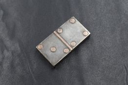 A Victorian silver novelty vesta case, modelled as a domino of rectangular form having rose metal