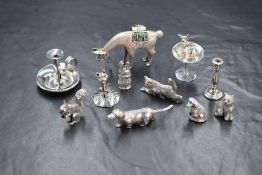 A group of eight silver and white metal presumed to be silver miniature animal figures, including