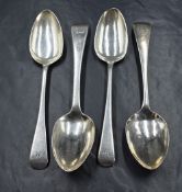 A group of four Georgian silver Old English pattern spoons, all having engravings to terminals,