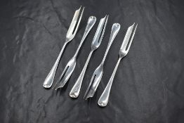 A group of five George V silver Hanoverian pattern dessert forks, marks for Sheffield 1925, maker